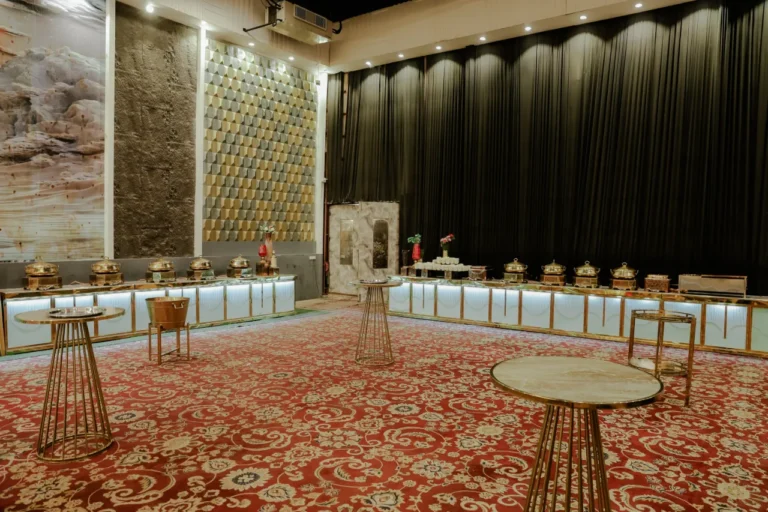 Interior of a ballroom with a large carpet.