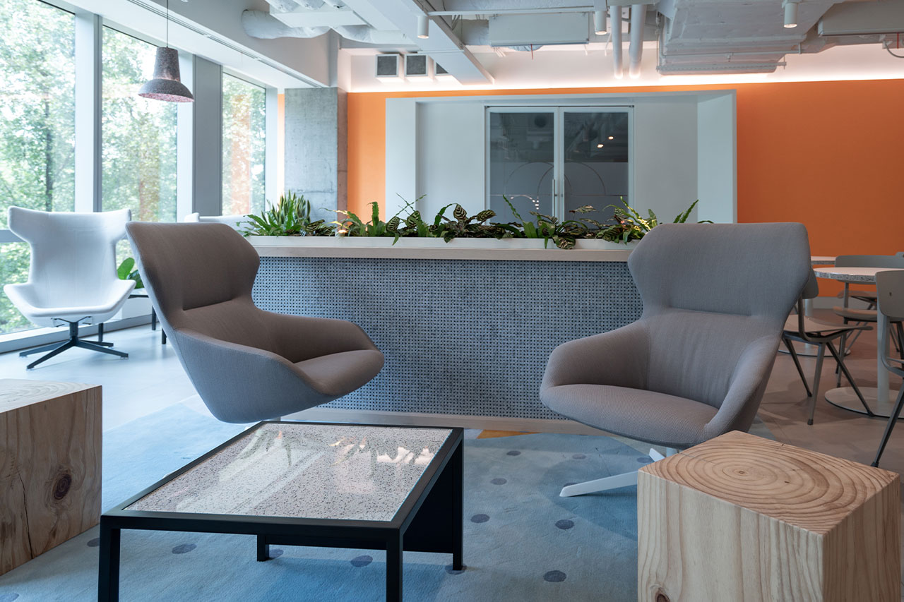 A contemporary office lounge with furniture